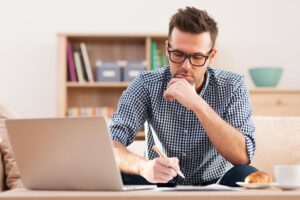 A man in front of his computer